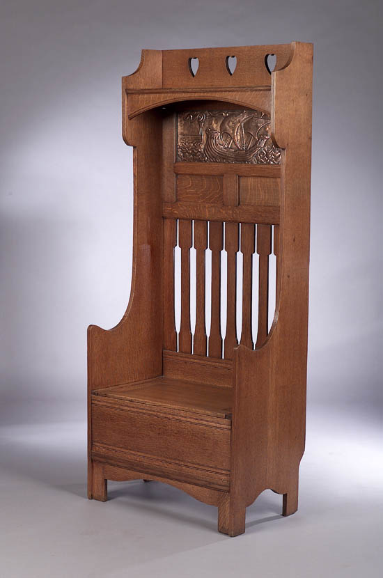 An Arts & Crafts oak hall settle