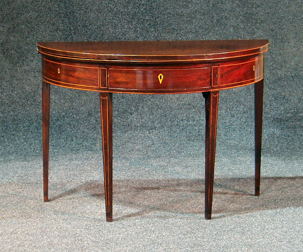 A George III mahogany boxwood strung demi-lune tea table