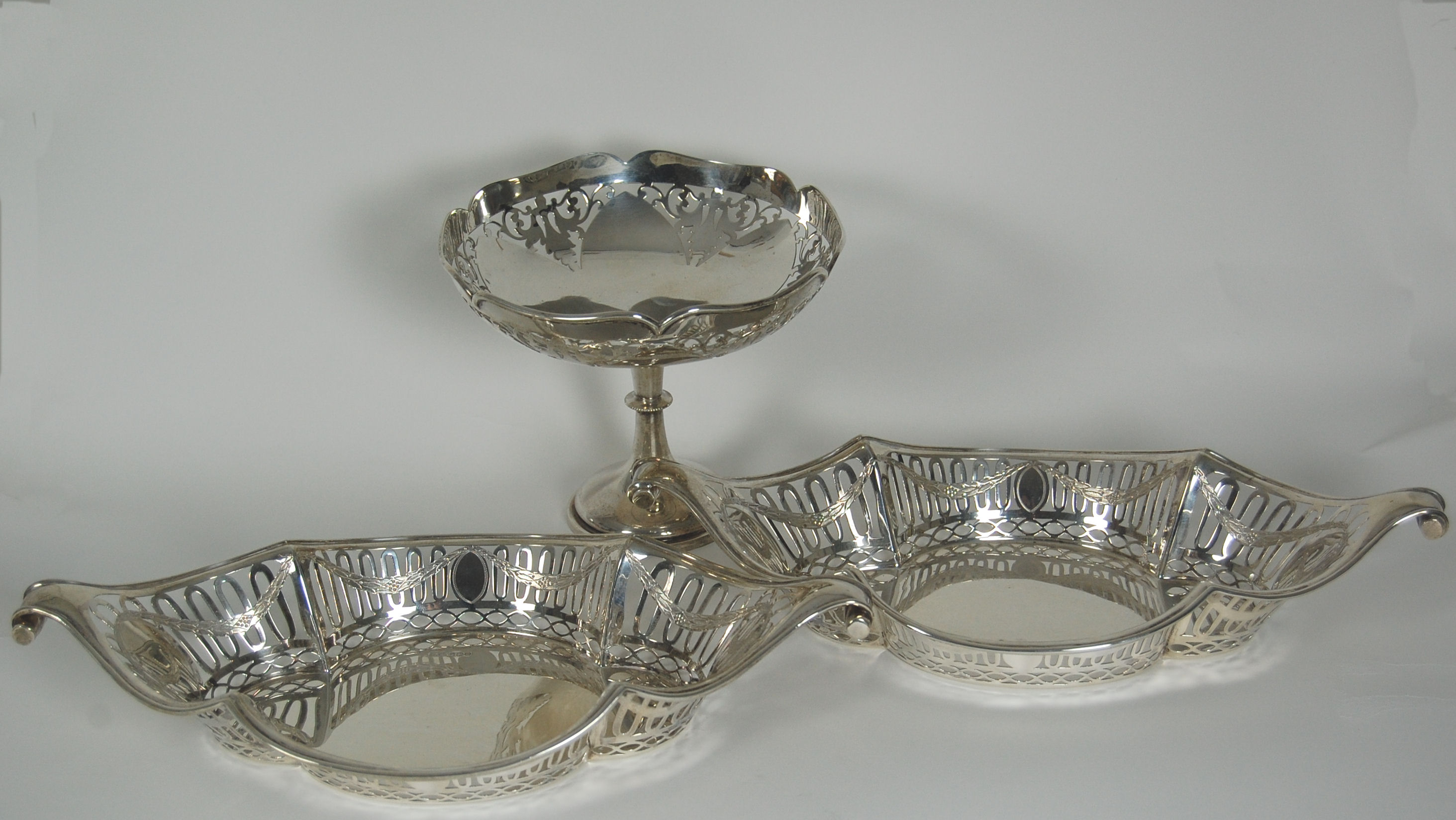 A pair of table baskets