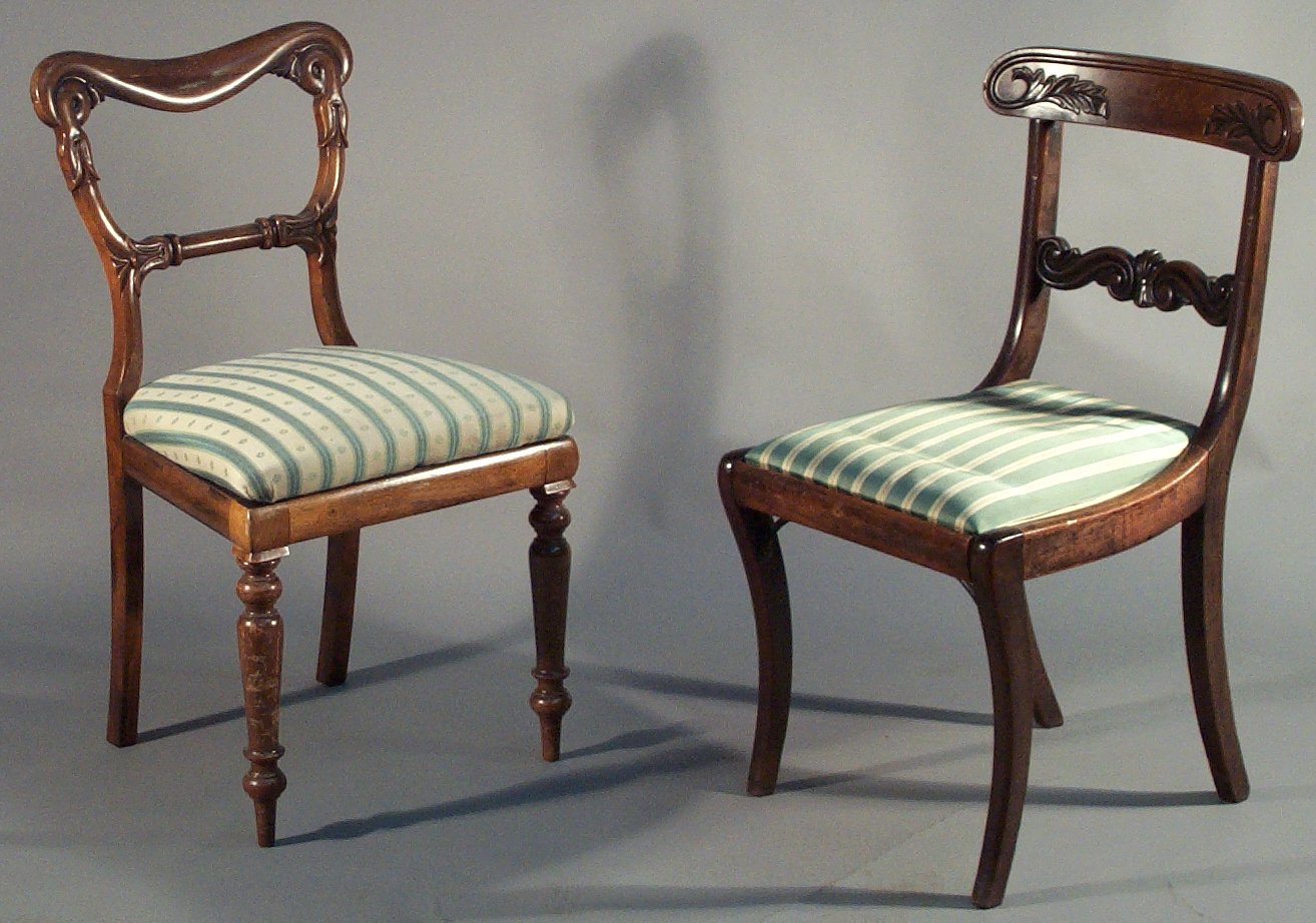 A set of four 19th century mahogany yoke back dining chairs