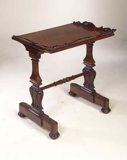 An early 19th century rosewood writing table,