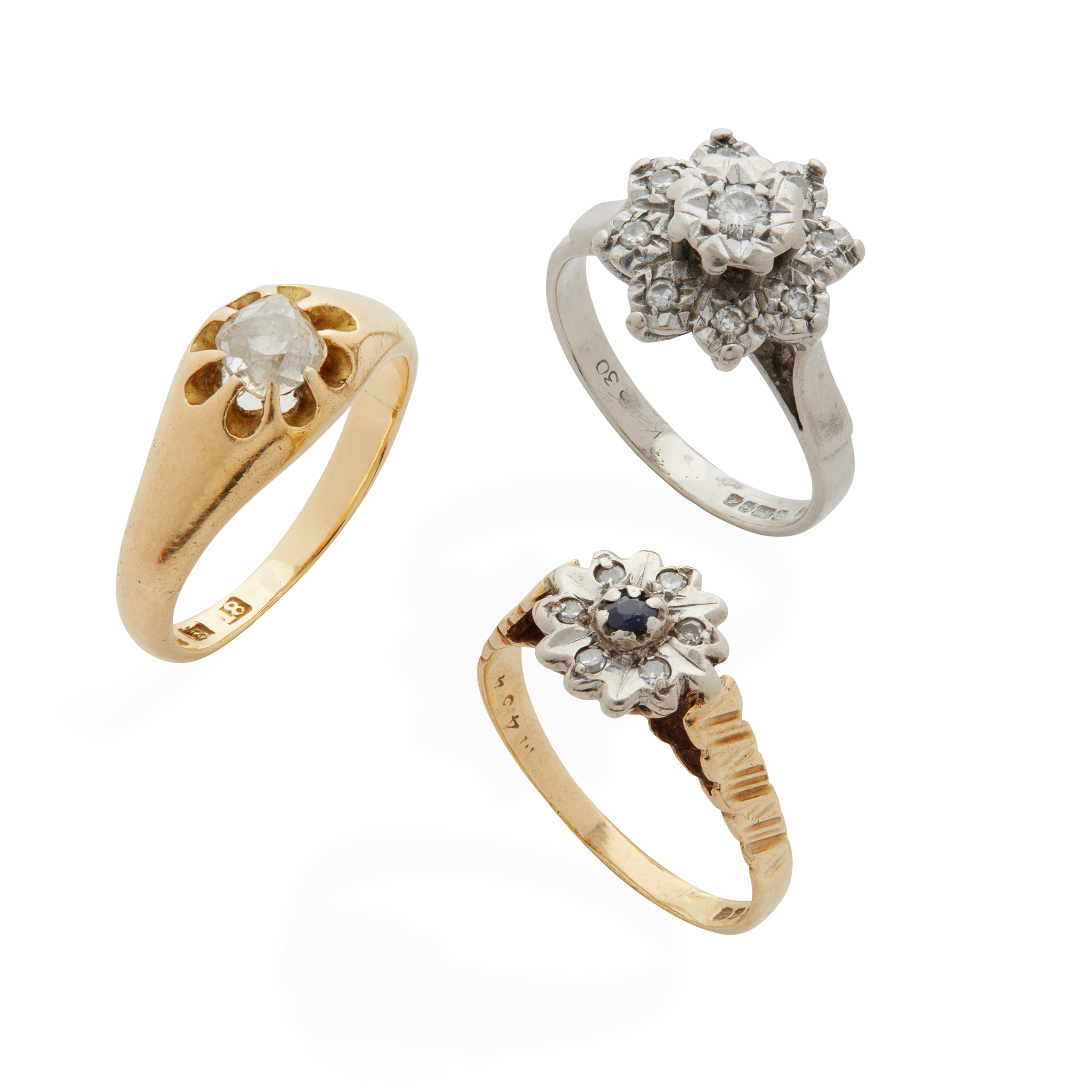 A collection of diamond and sapphire rings