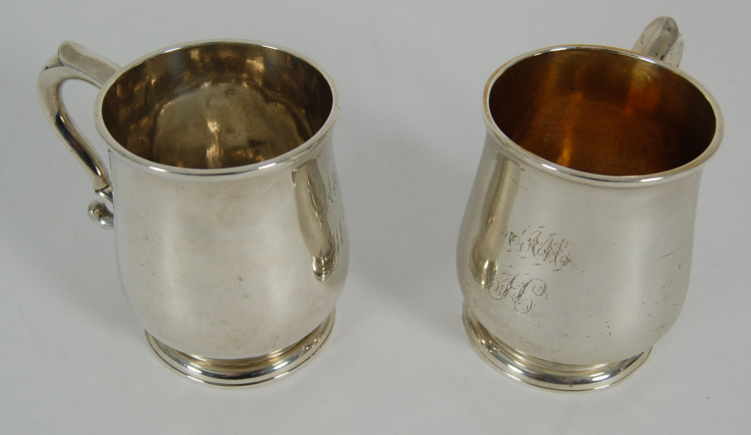 A pair of George II baluster mugs