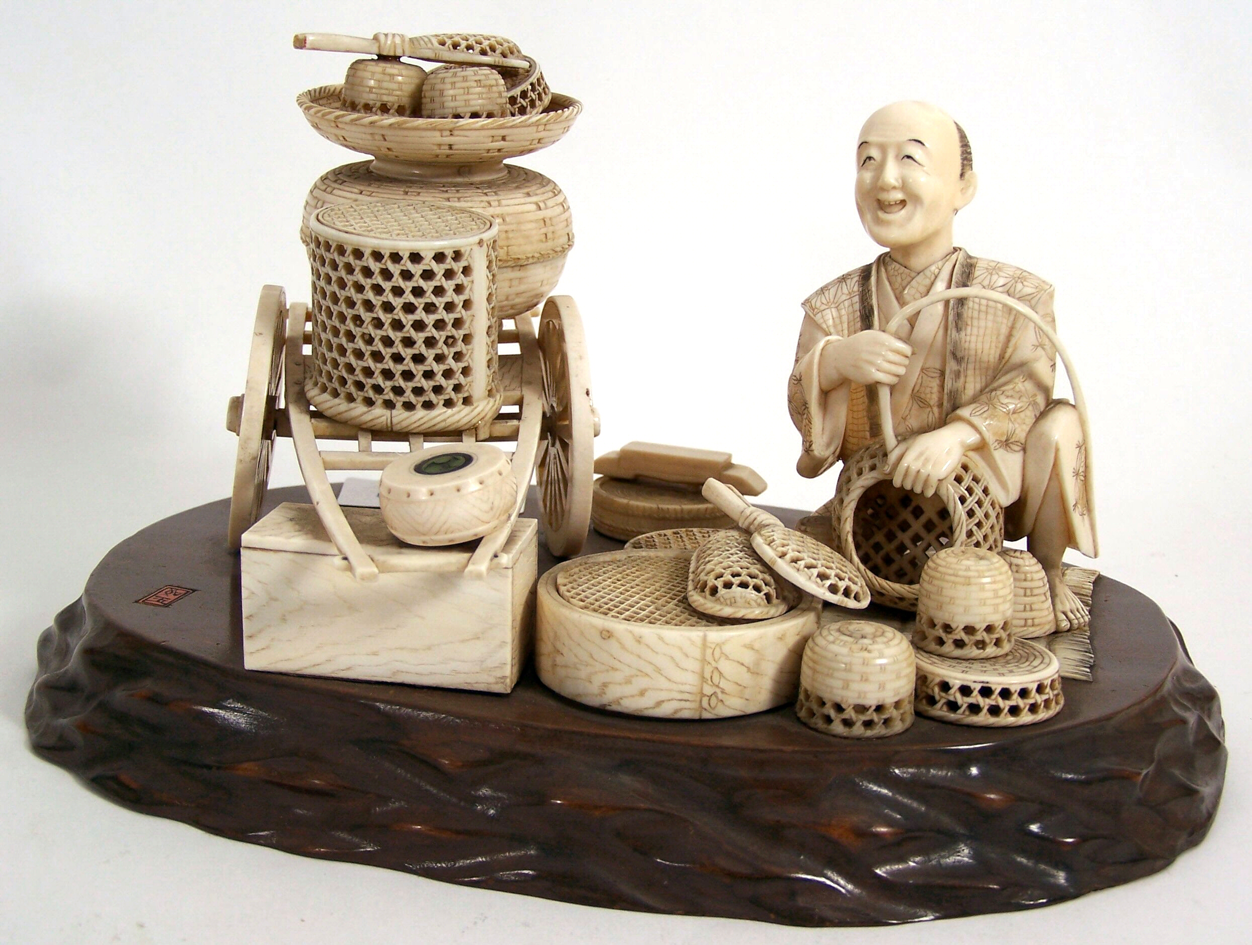 A Japanese ivory figure group,