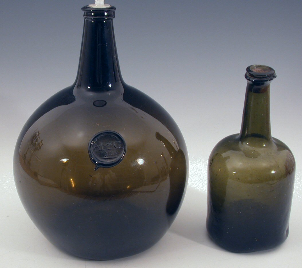 A large early nineteenth century green glass wine bottle