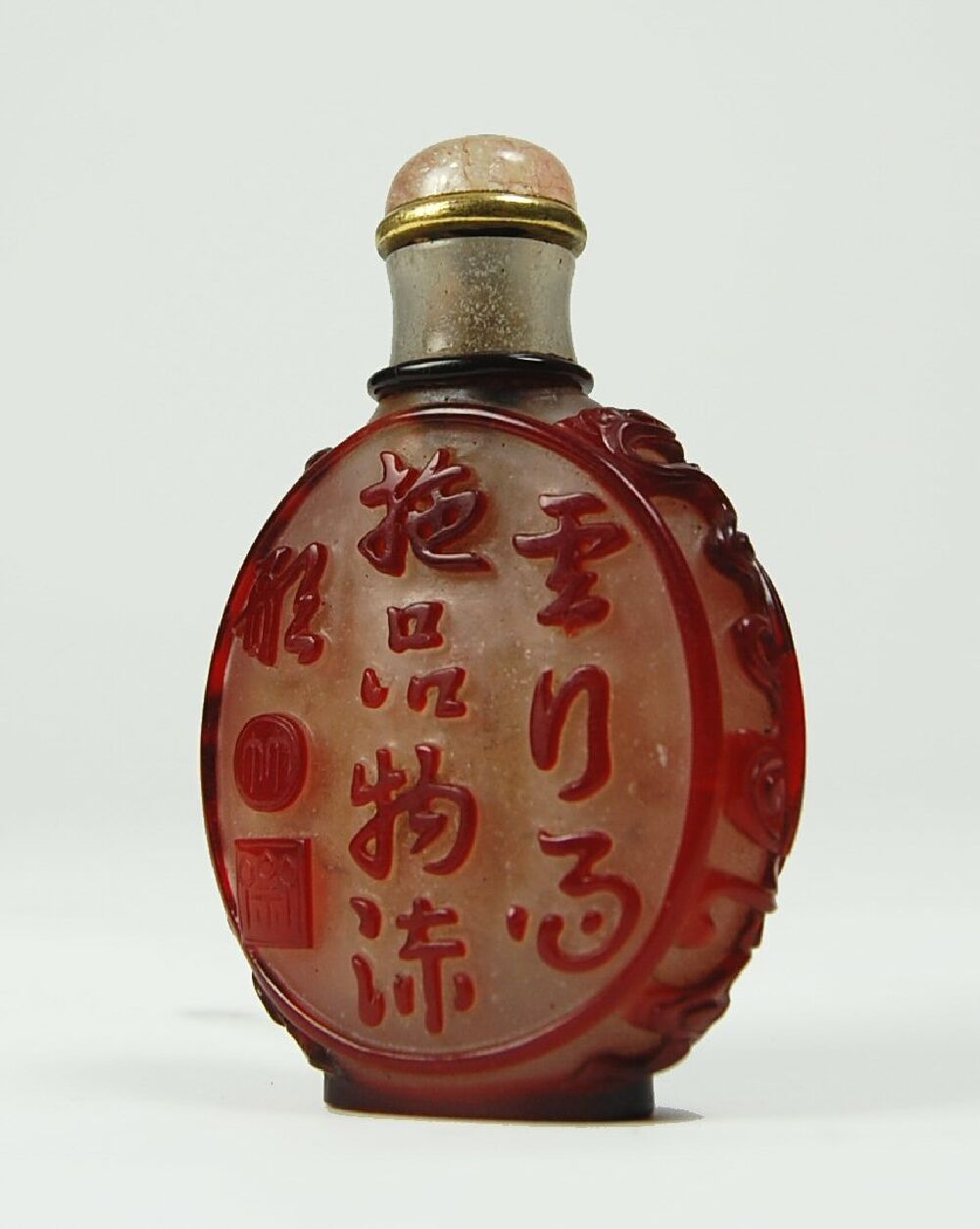 A Chinese ruby glass overlain snuff bottle