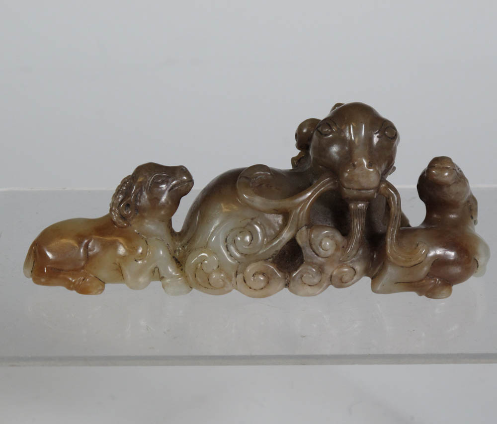 A Chinese jade figure group of a family of goats
