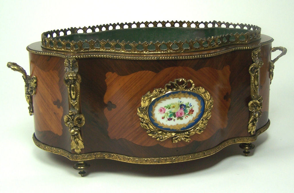 A 19th century serpentine kingwood and rosewood jardiniere In the Louis XV style