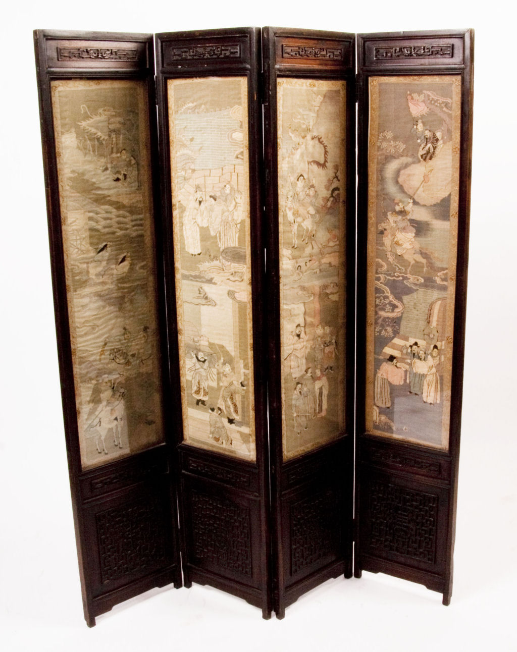 A late 19th century Chinese four fold screen with silk panels