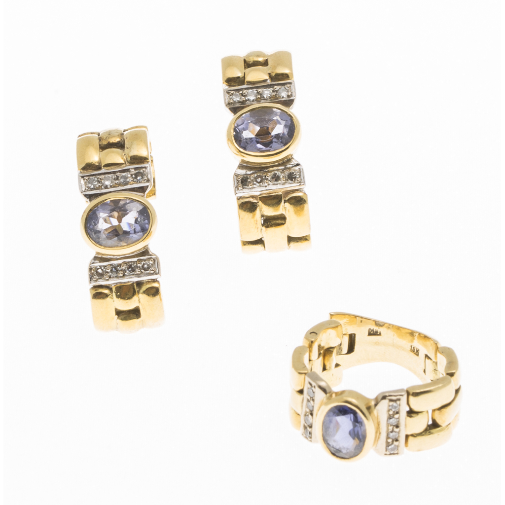 A pair of sapphire and diamond ear clips and ring