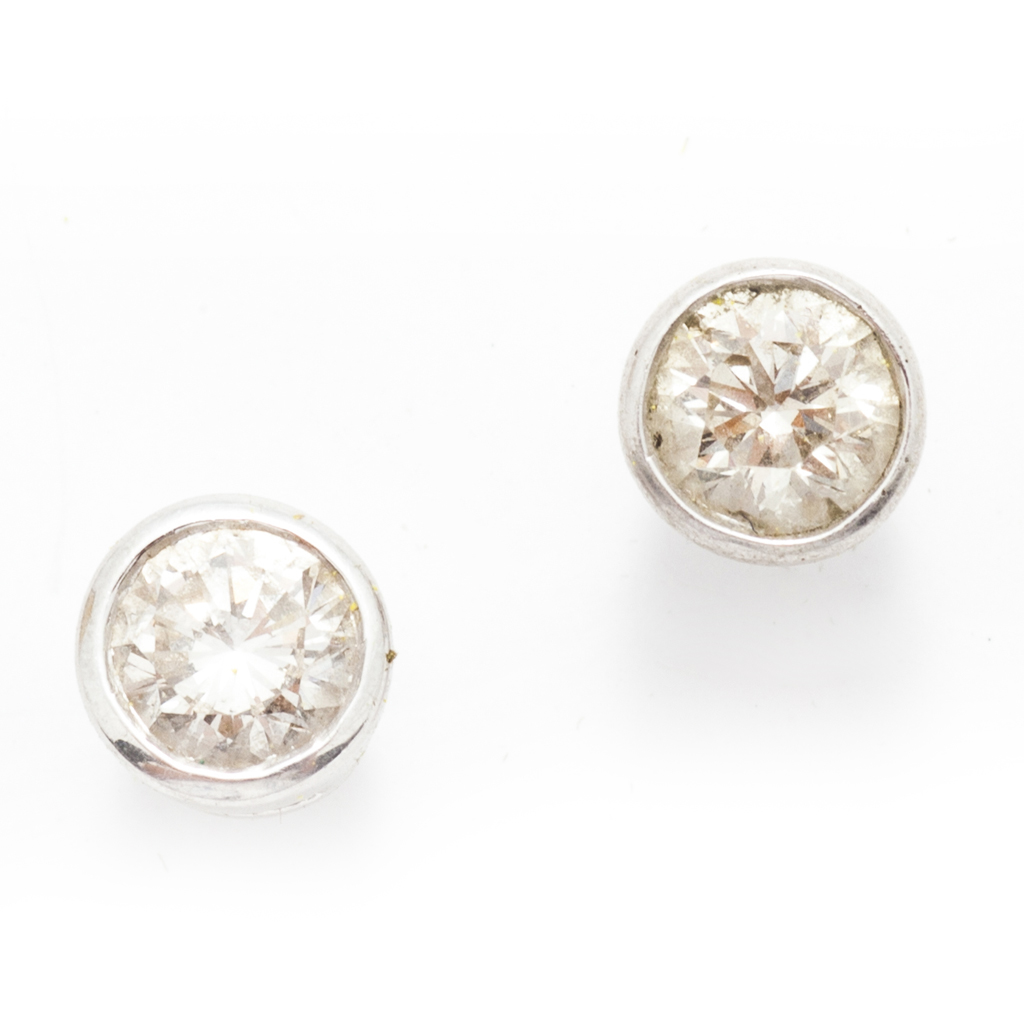 A pair of platinum and diamond set ear-studs