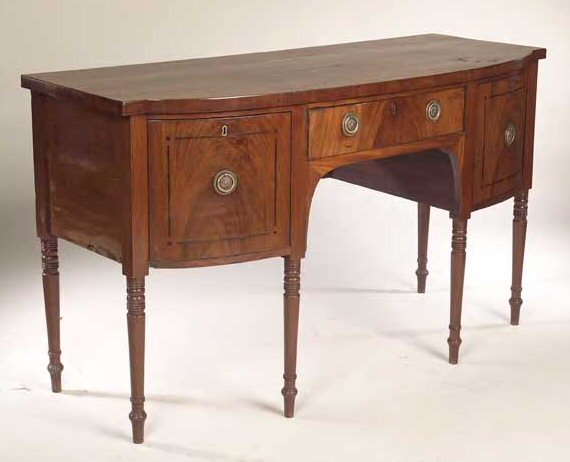 An early 19th century mahogany bow front sideboard,