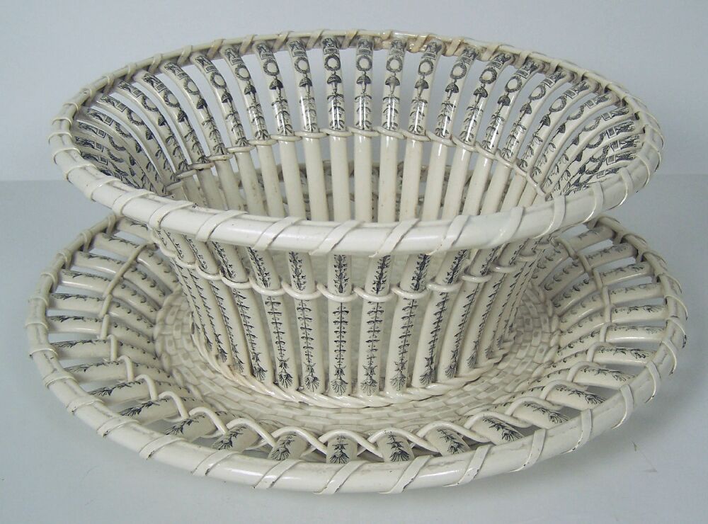 A pair of late 19th century Creil creamware baskets and stands