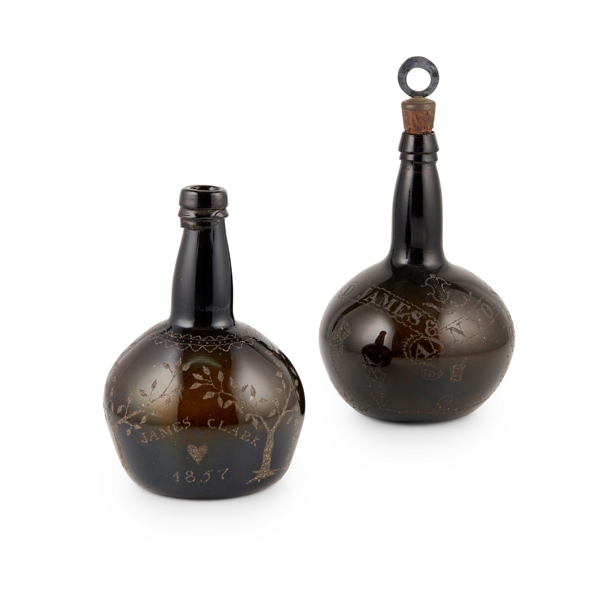 TWO CHIP ENGRAVED GREEN GLASS BOTTLES