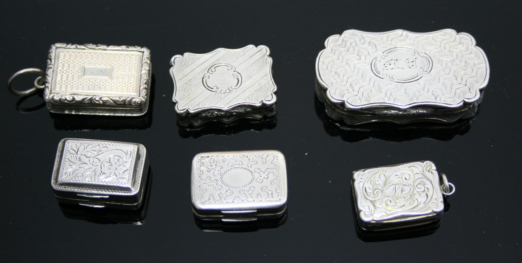 A group of silver vinaigerettes