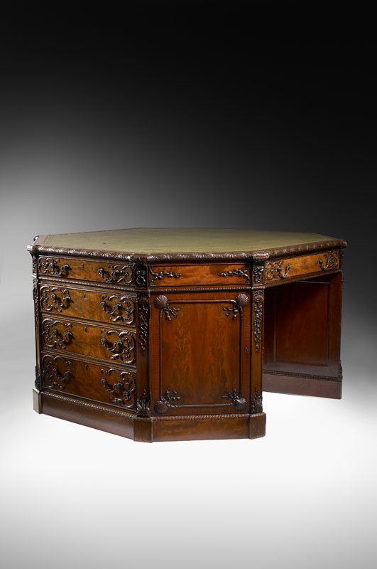 A fine late 19th/early 20th century George III style octagonal mahogany partners desk By H. Samuel, London