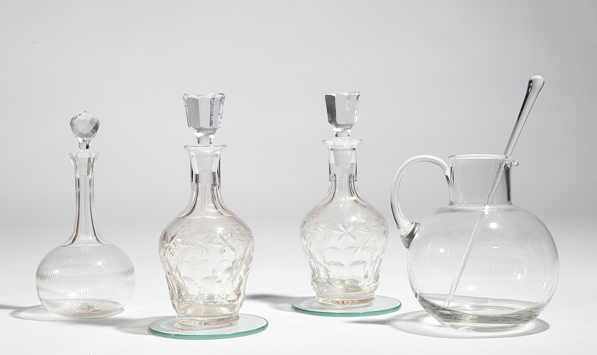PAIR OF CUT GLASS DECANTERS AND STOPPERS