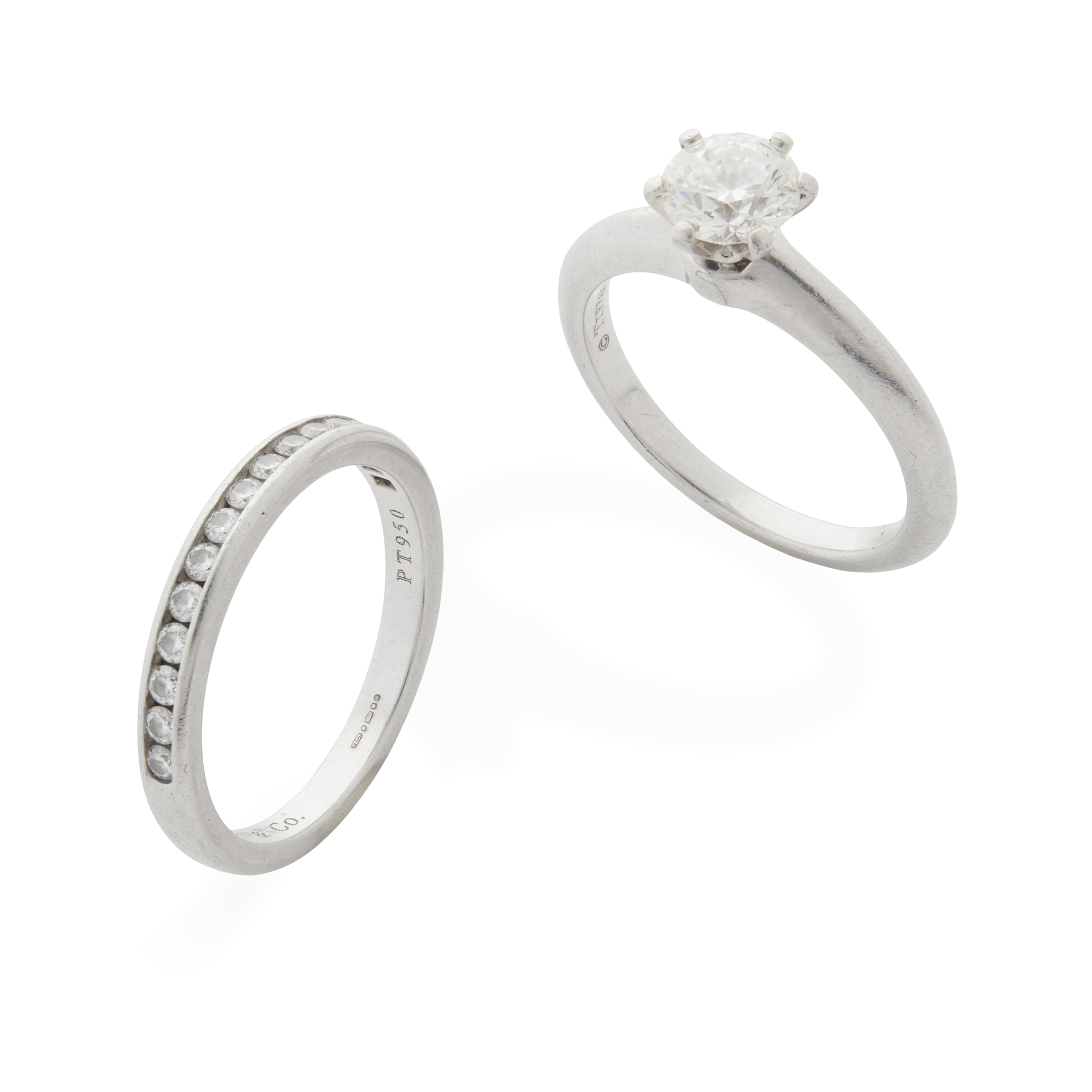 Tiffany & Co: A diamond single-stone ring and matching diamond band