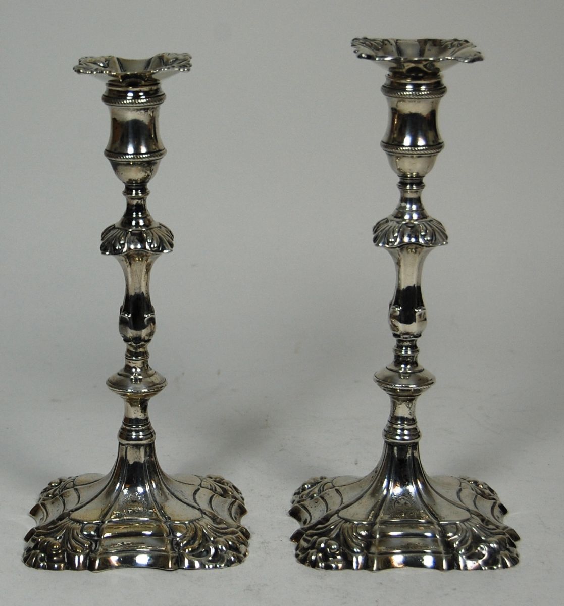 A pair of George II candlesticks