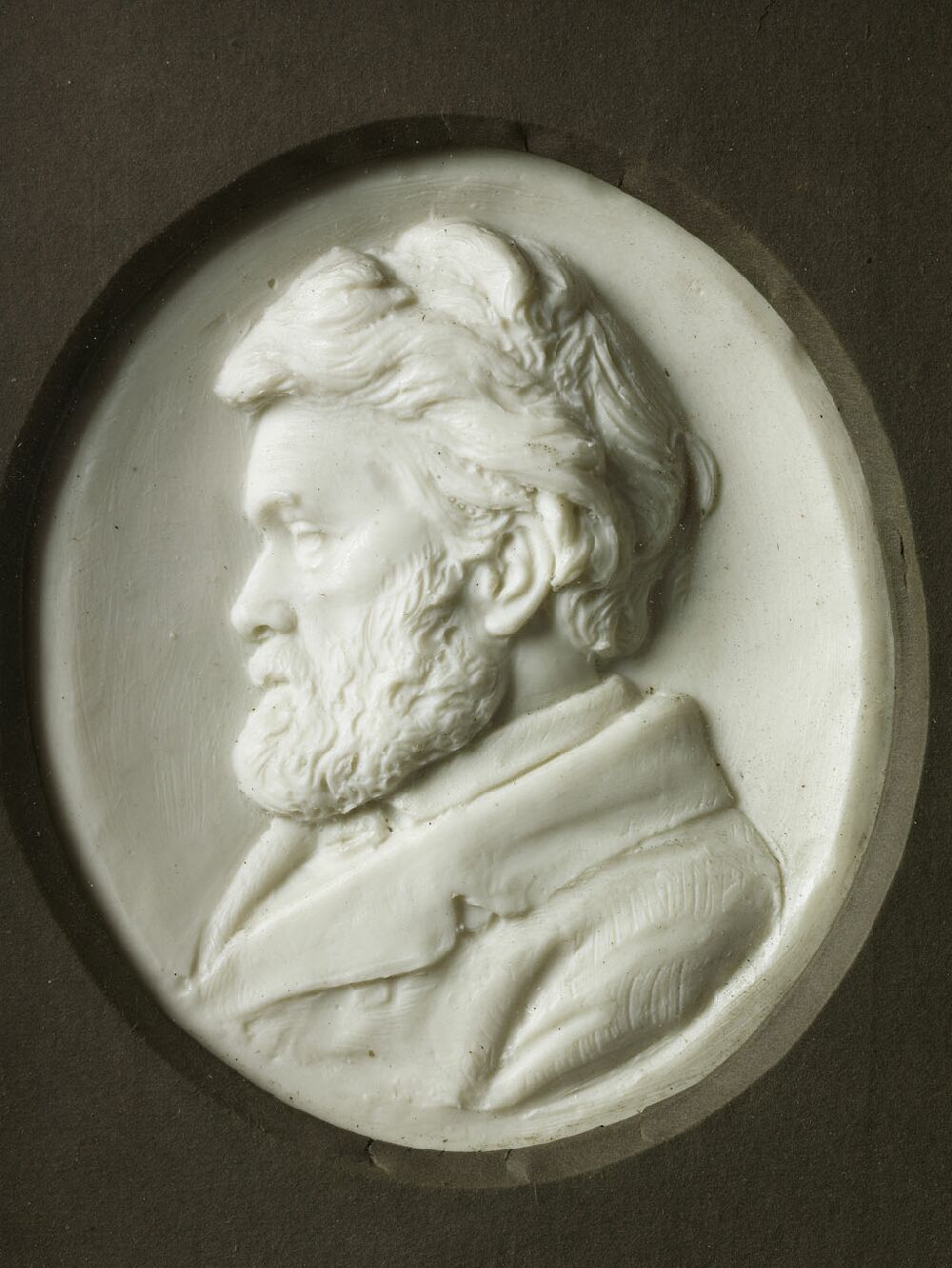 A 19th century wax portrait relief of Thomas Carlyle, circa 1875 By Sir Joseph Edgar Boehm, Bart, RA (1834-1890)
