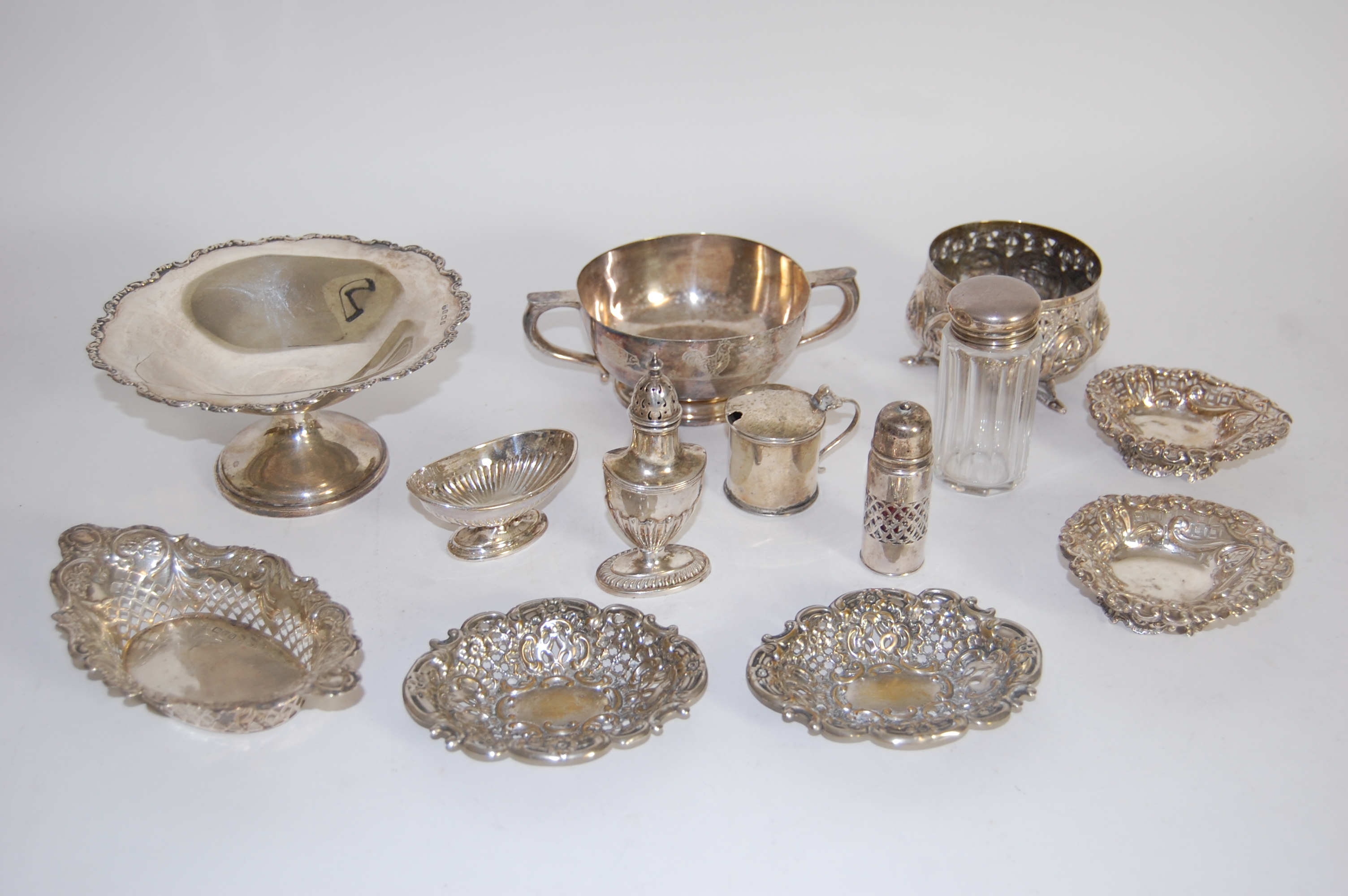 A group of silver dishes
