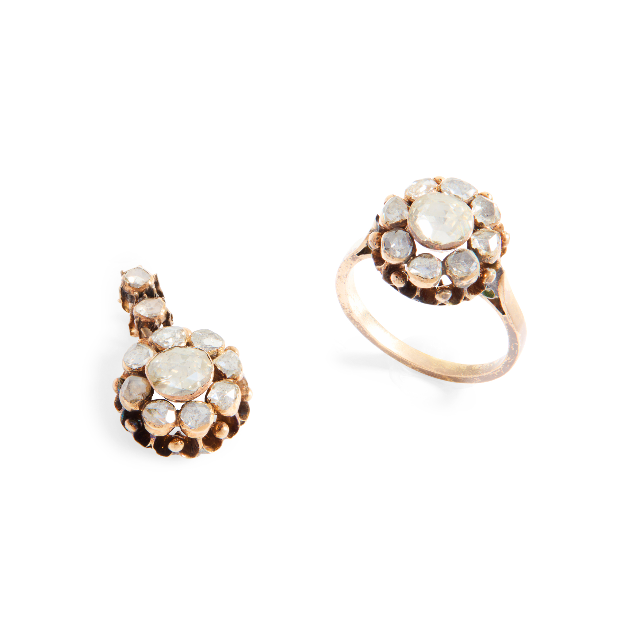 A diamond cluster ring and matching pendant