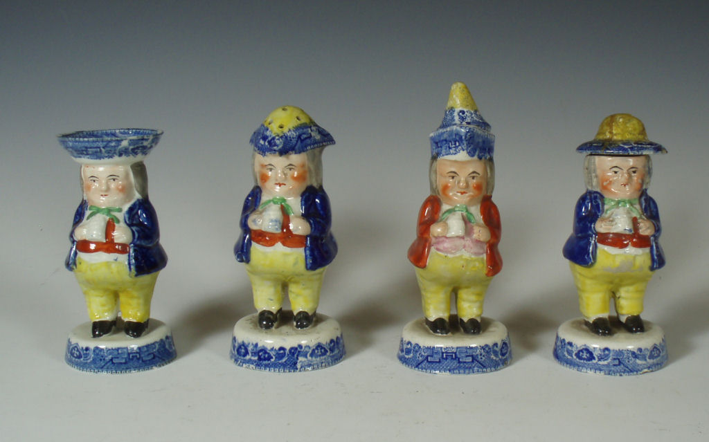 A group of four Scottish pottery 'Toby' figure condiment pots Probably Prestonpans