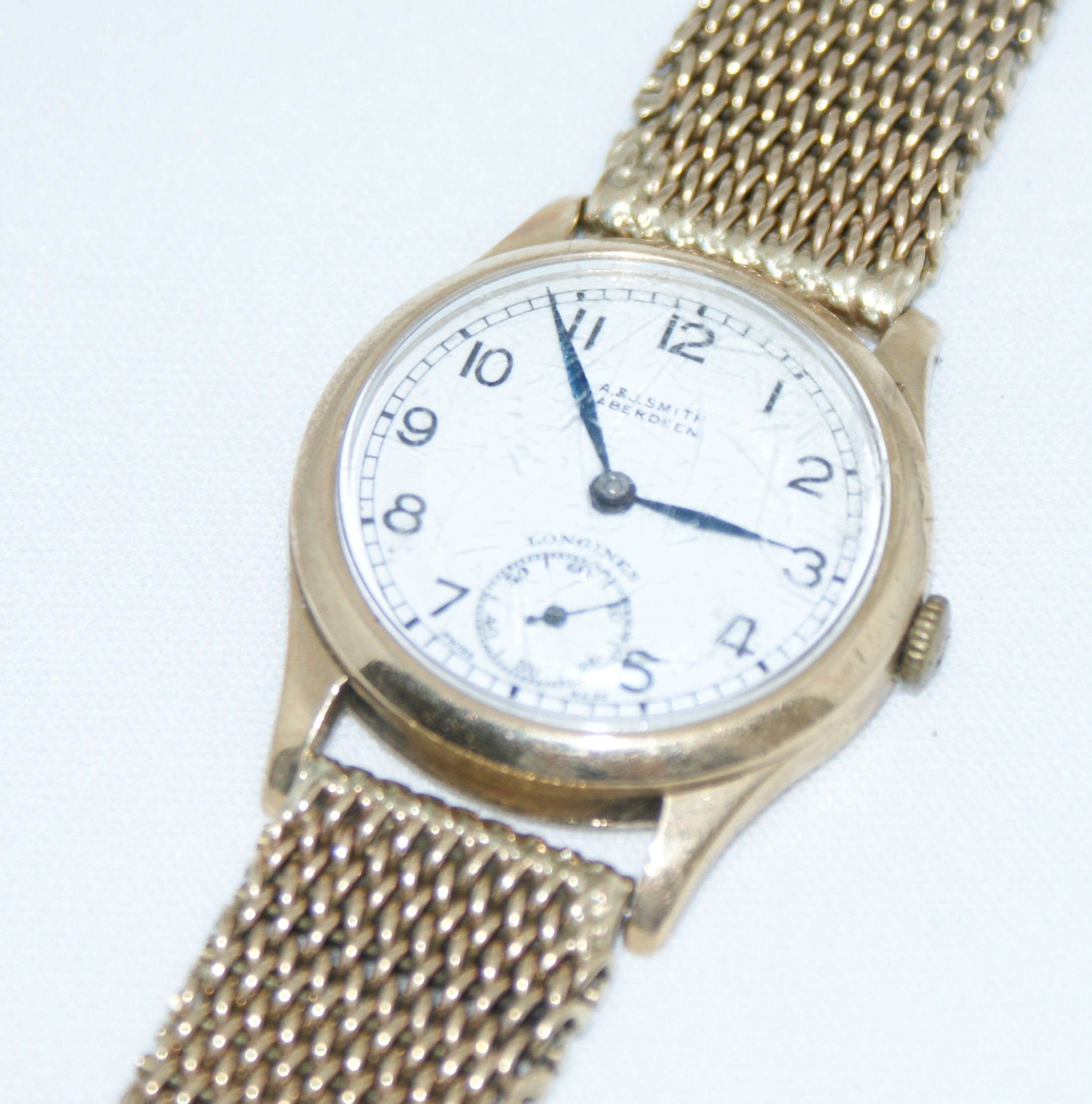 LONGINES - a gentleman's 1940's 9ct gold wrist watch,