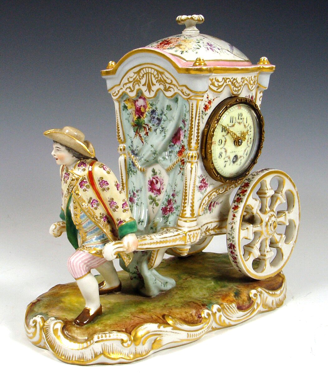 A Dresden porcelain figural cased clock,