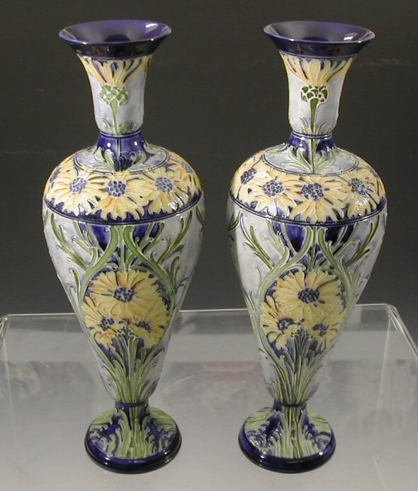 A near pair of Moorcroft 'Florian Ware' vases,