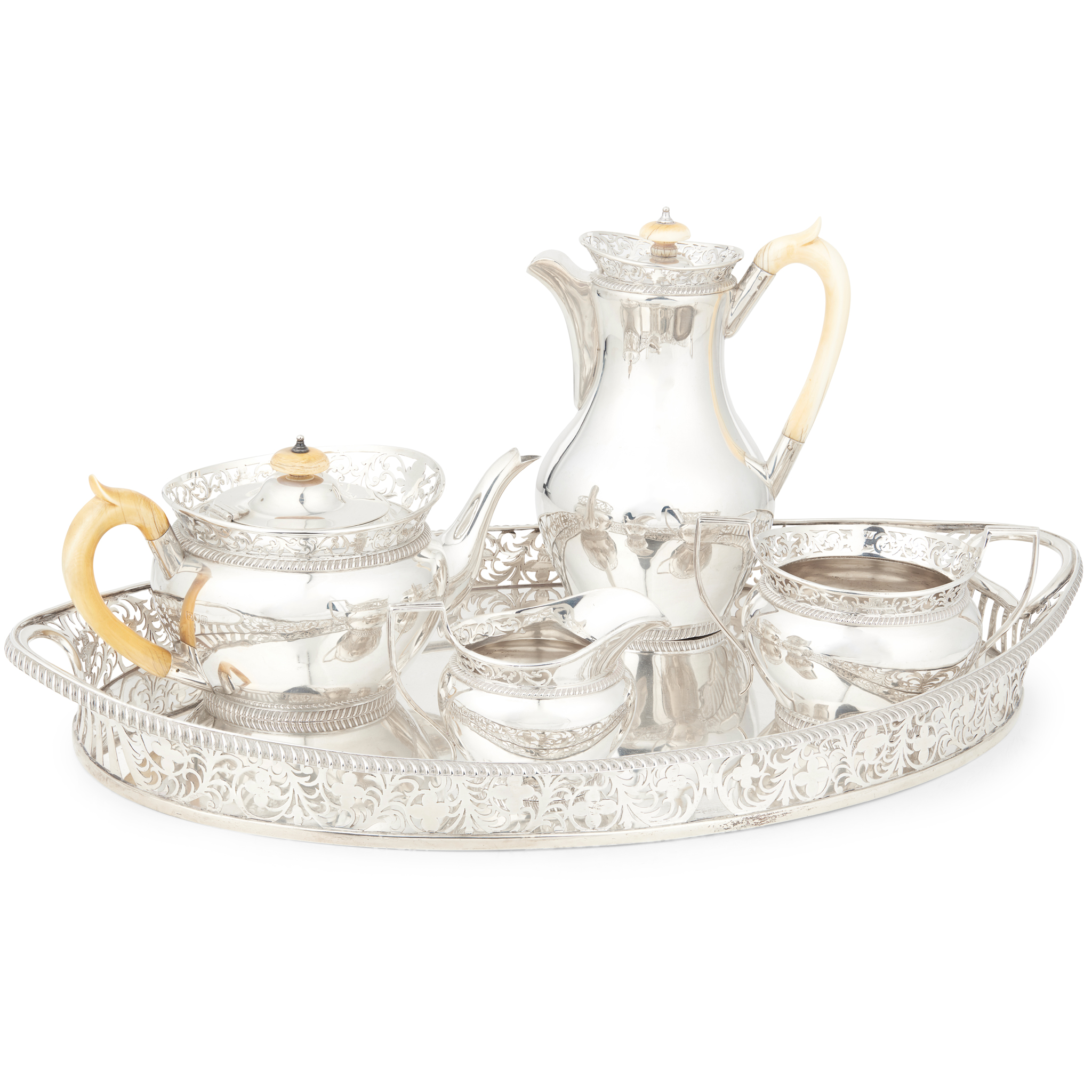 A matched Edwardian four-piece tea service and a twin handled gallery tray