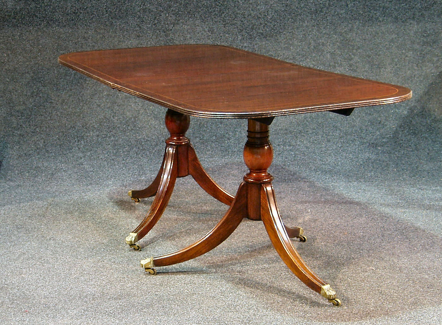A mahogany twin pedestal dining table