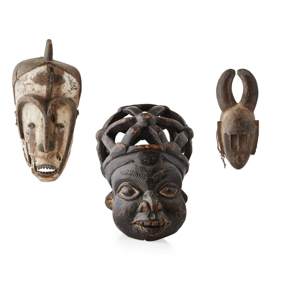 GROUP OF THREE CARVED WOOD TRIBAL MASKS