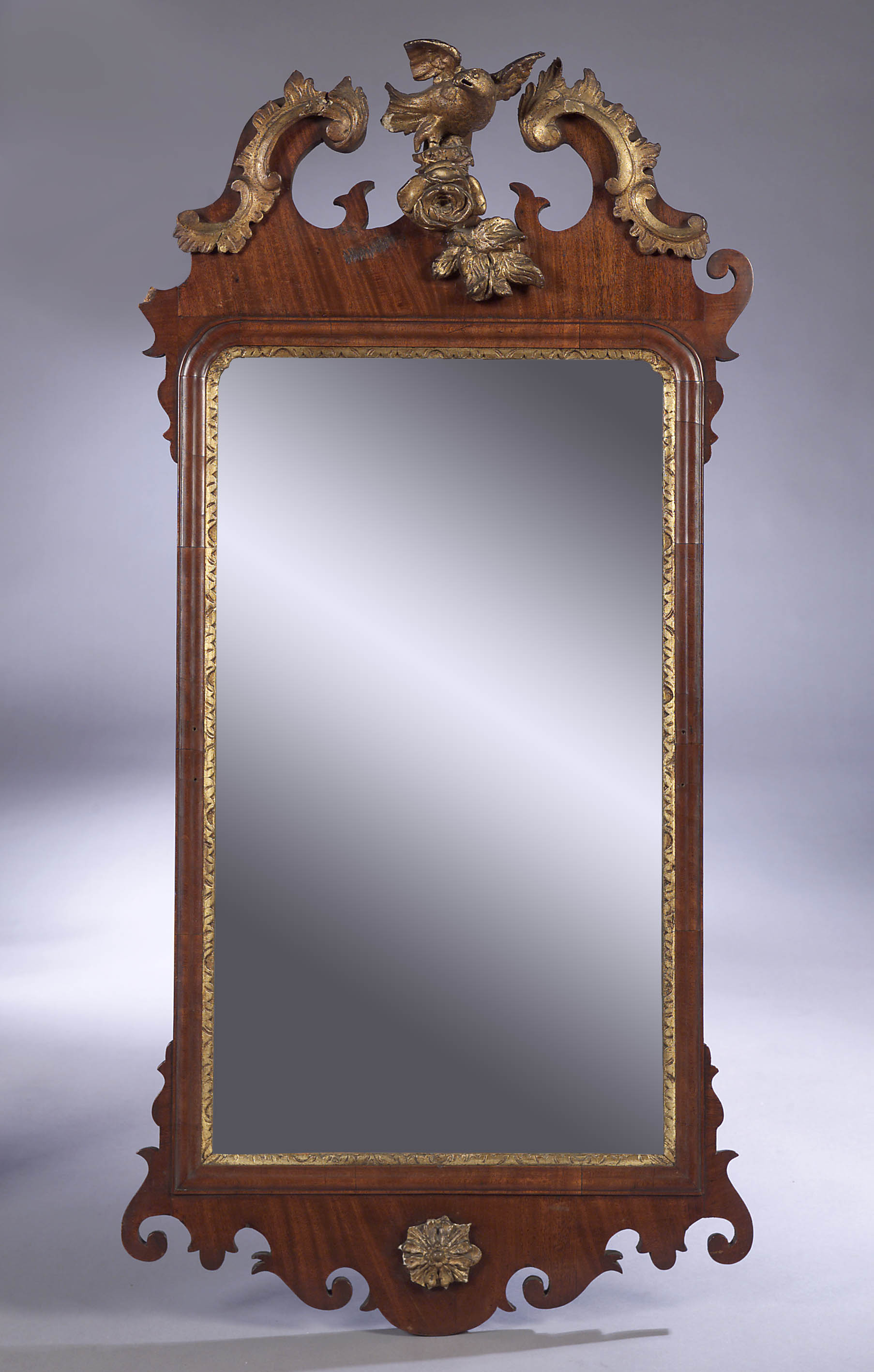 A George III mahogany and giltwood wall mirror