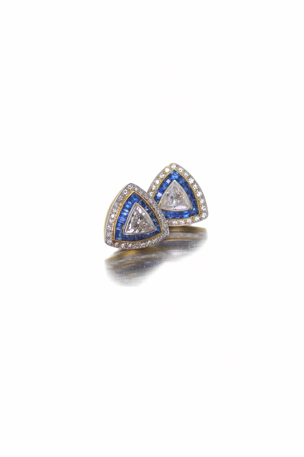 A pair of Art Deco style sapphire and diamond earrings,