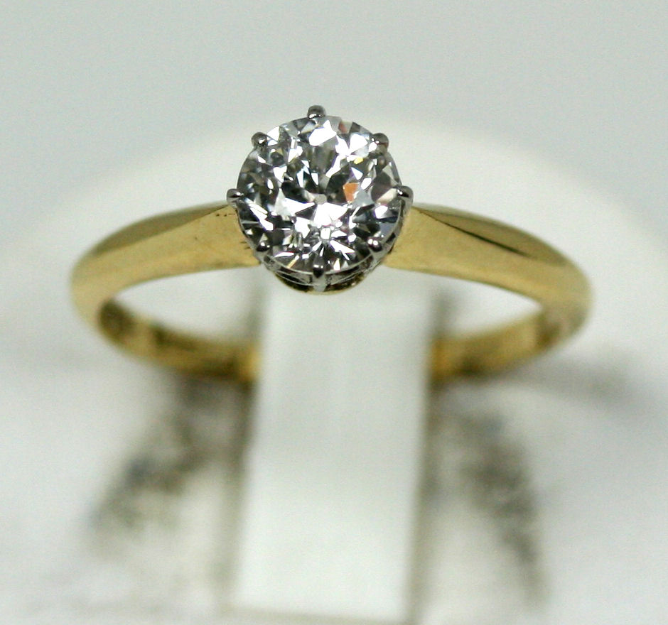 An 18ct gold mounted diamond single-stone ring