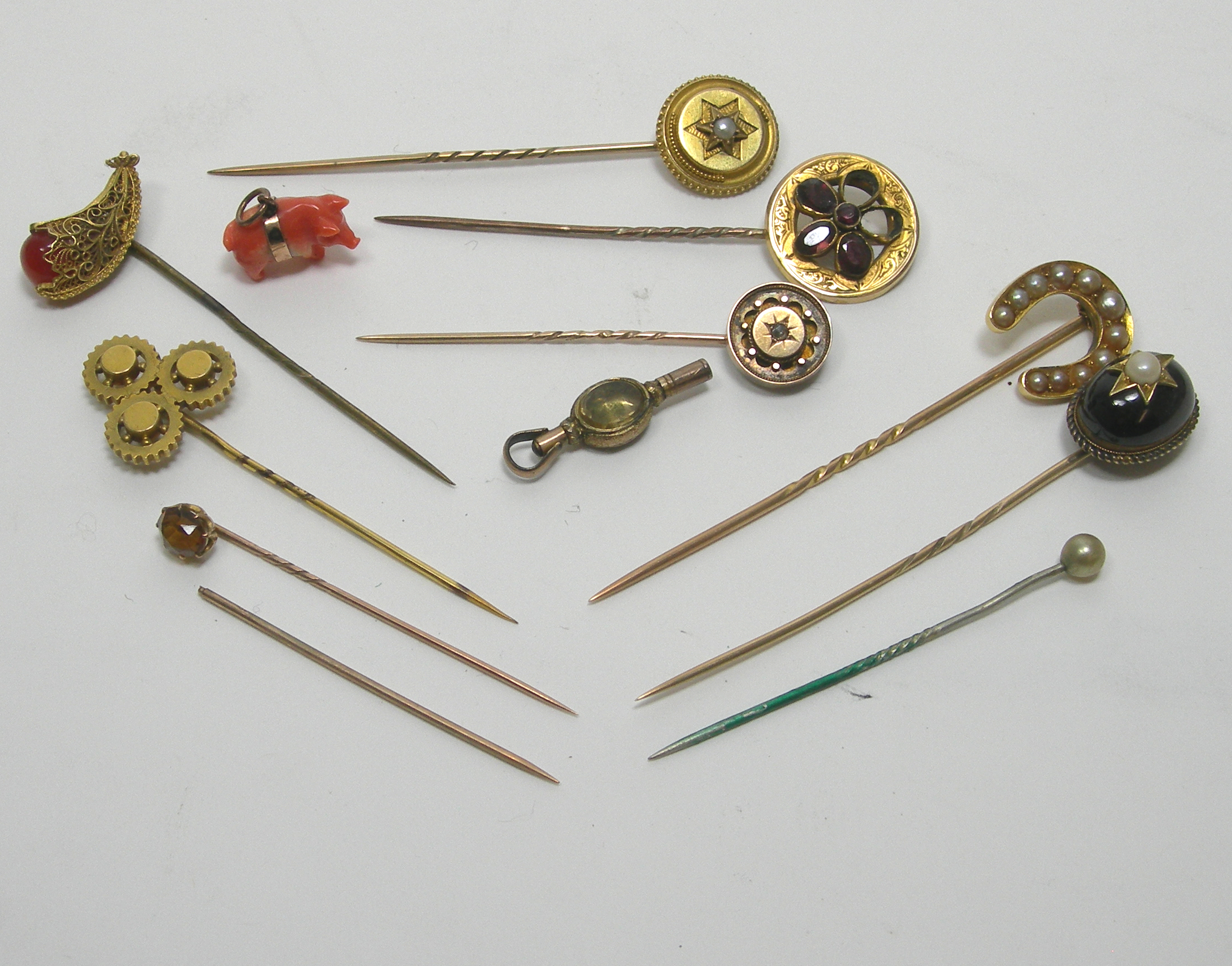 A collection of assorted stickpins,