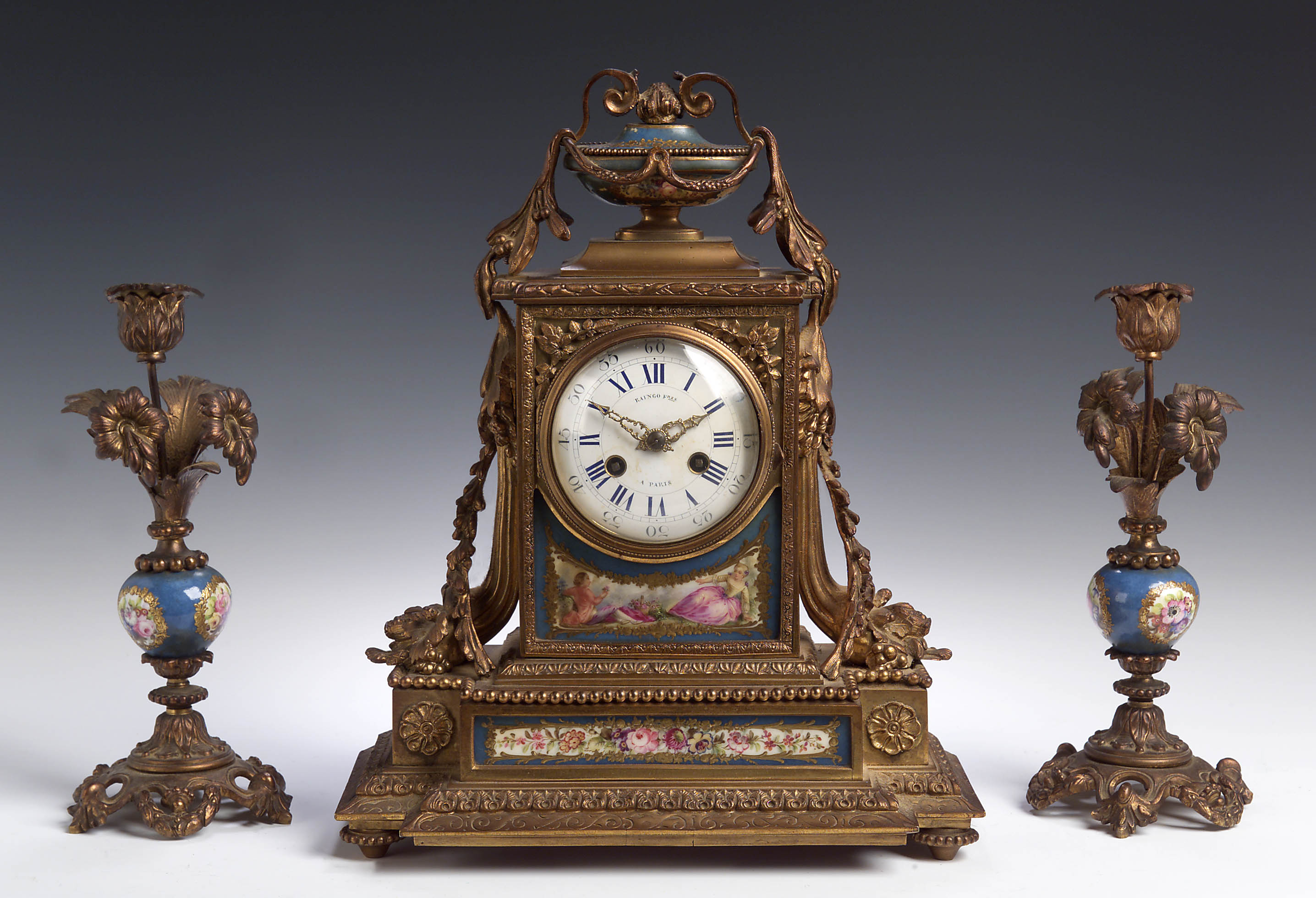 R. Freres, Paris A late 19th century gilt metal clock garniture,