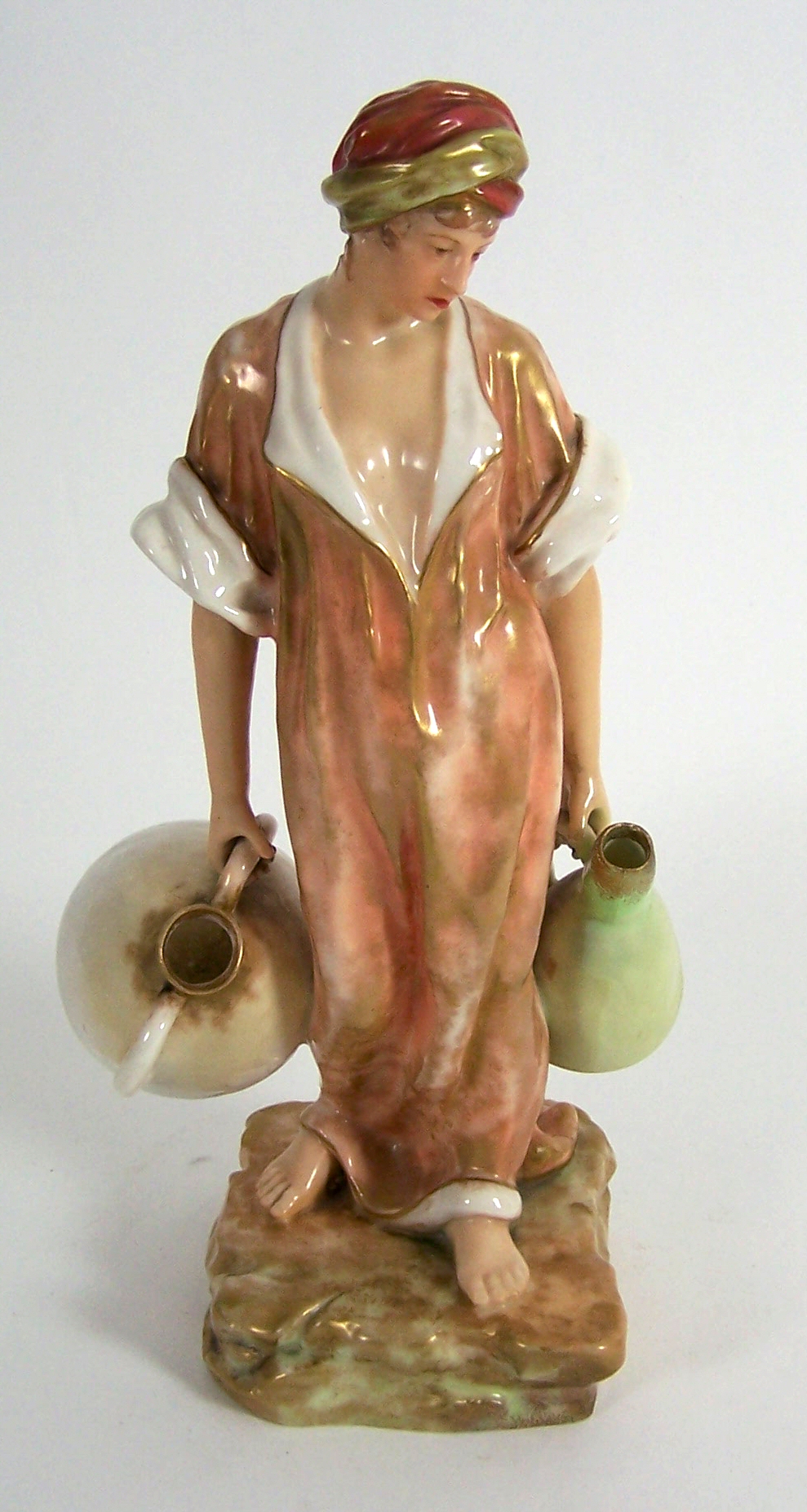 A Nautilus porcelain figure of a water carrier,