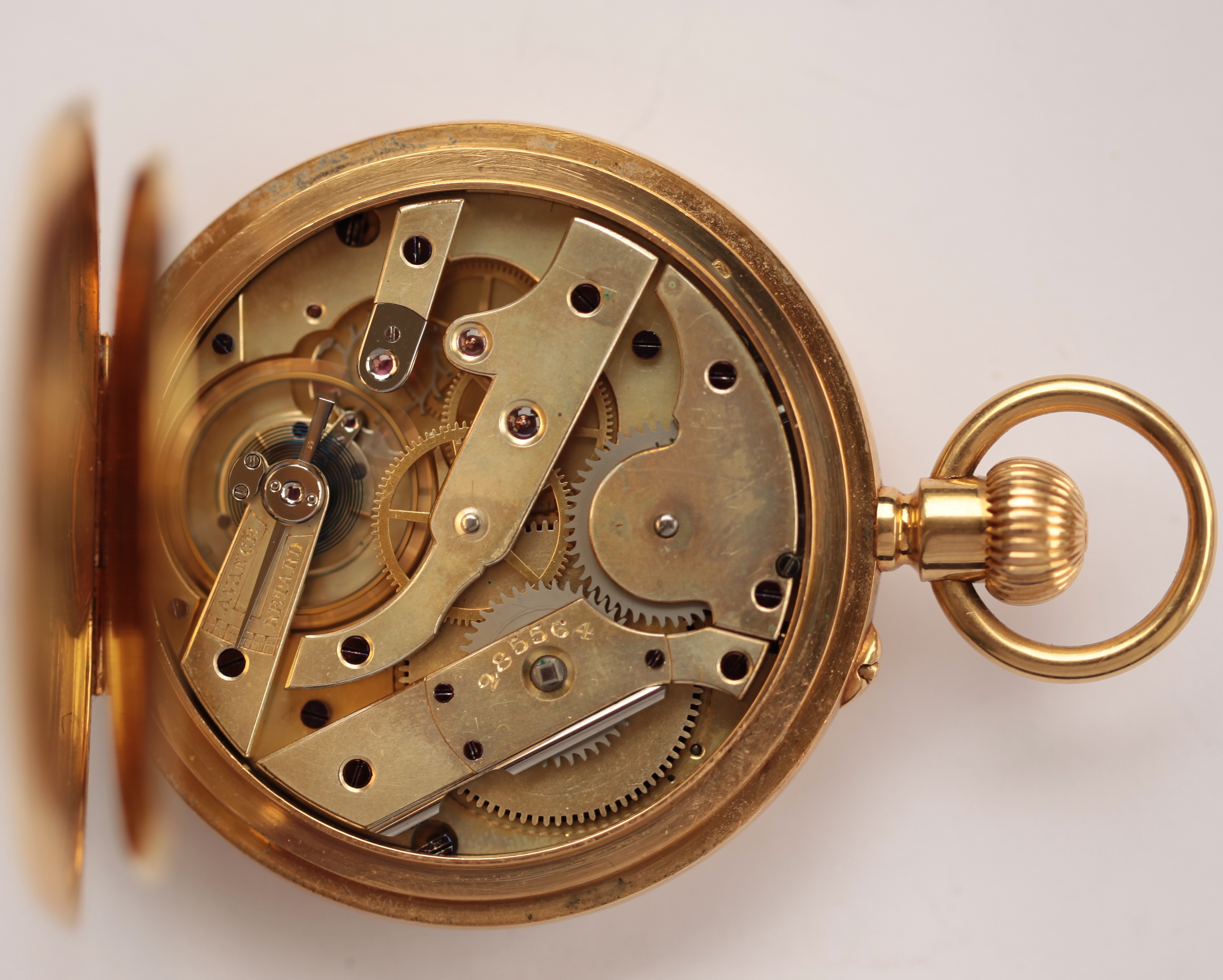 An 18ct gold cased half hunter keyless wind pocket watch