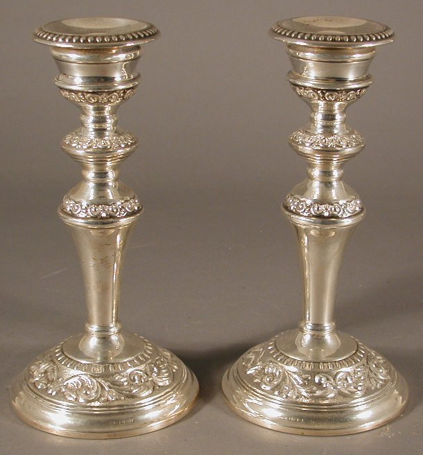A pair of dwarf silver table candlesticks