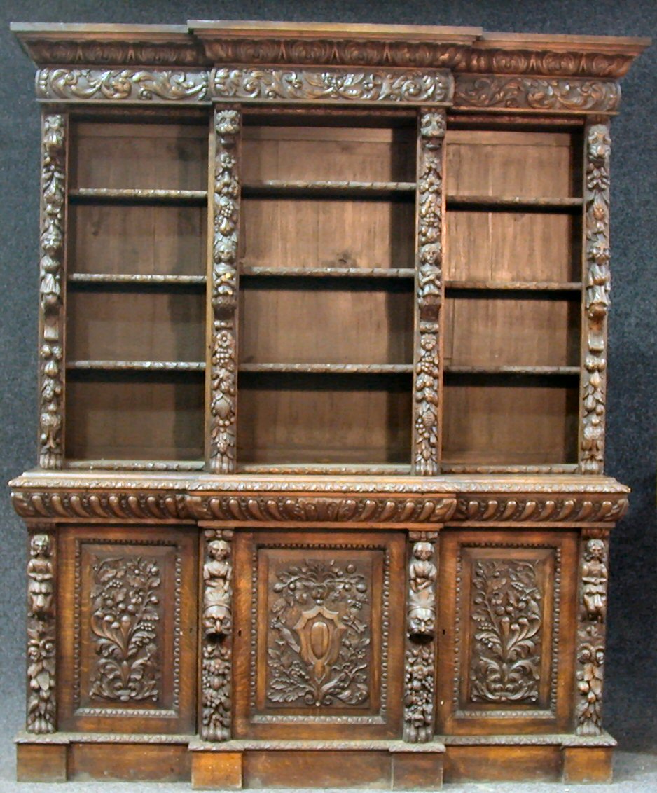 A Victorian architectural oak breakfront bookcase,