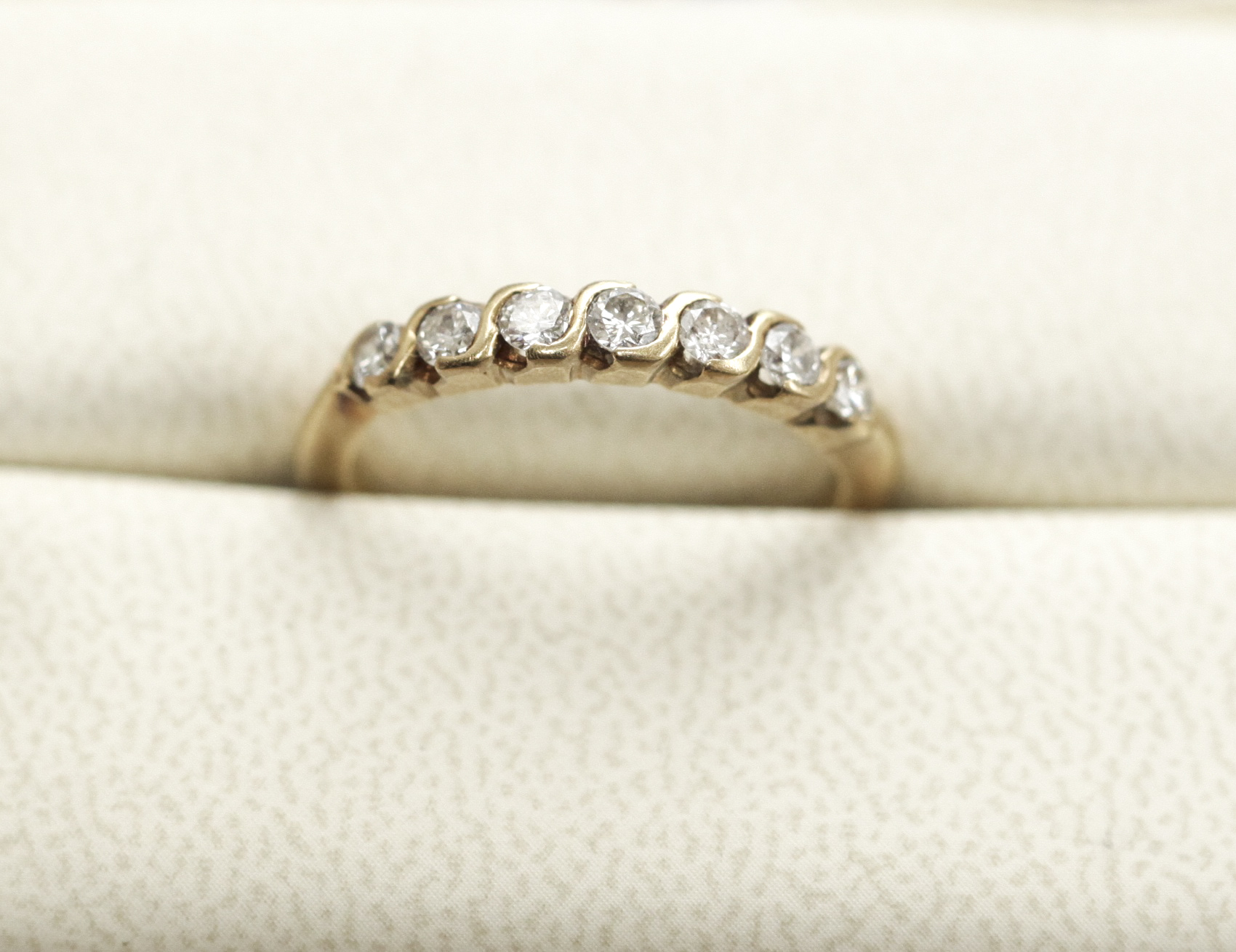 A modern 18ct gold mounted diamond half eternity ring