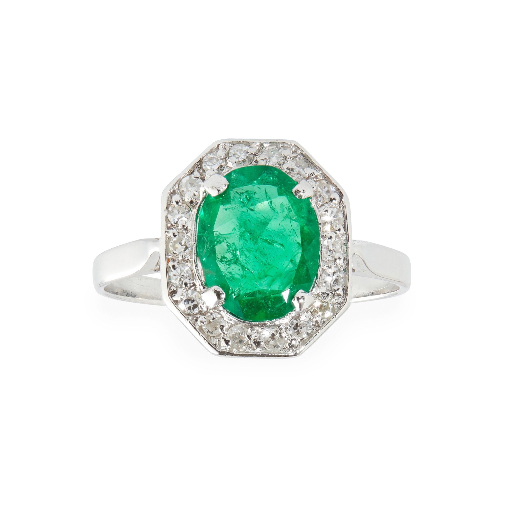 An emerald and diamond set ring