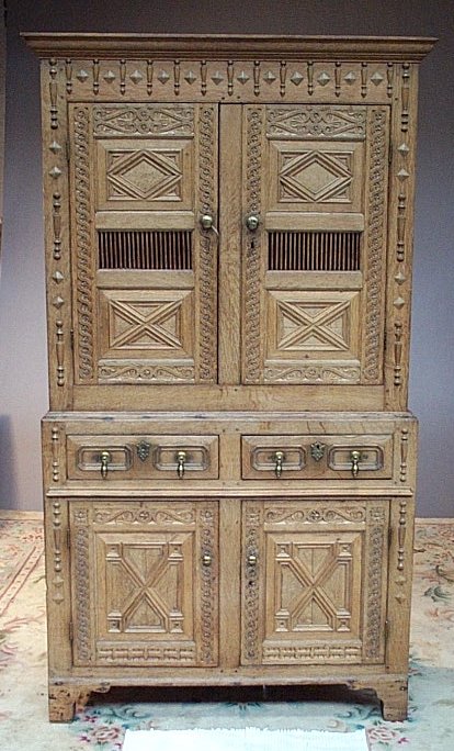 A pine and blond oak cabinet