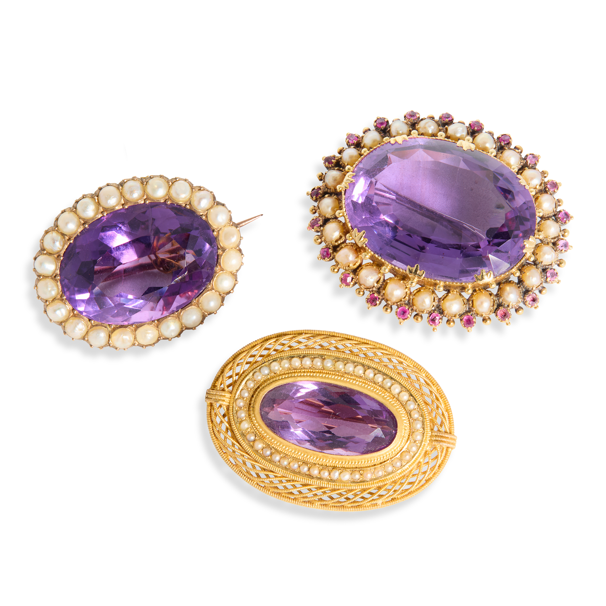 Three amethyst brooches