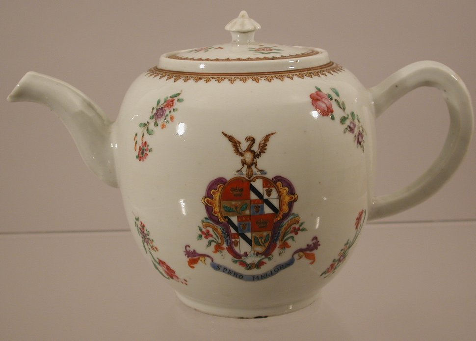 A large Chinese 18th century famille rose armorial globular teapot, en-suite