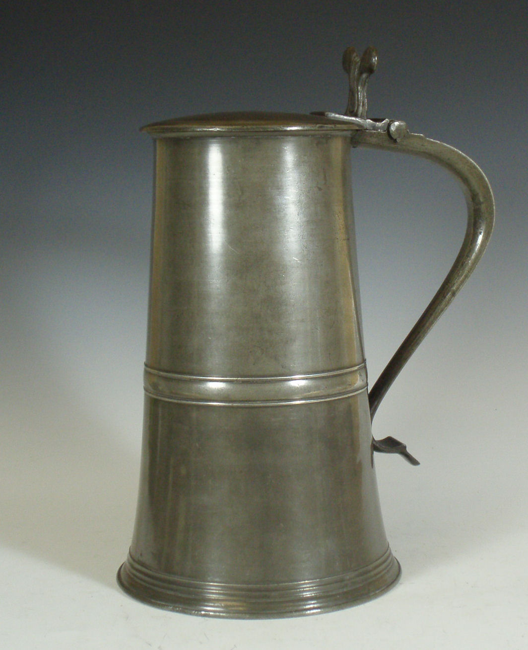 A Scottish flat lidded pewter flagon