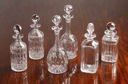 A pair of cut glass decanters and stoppers