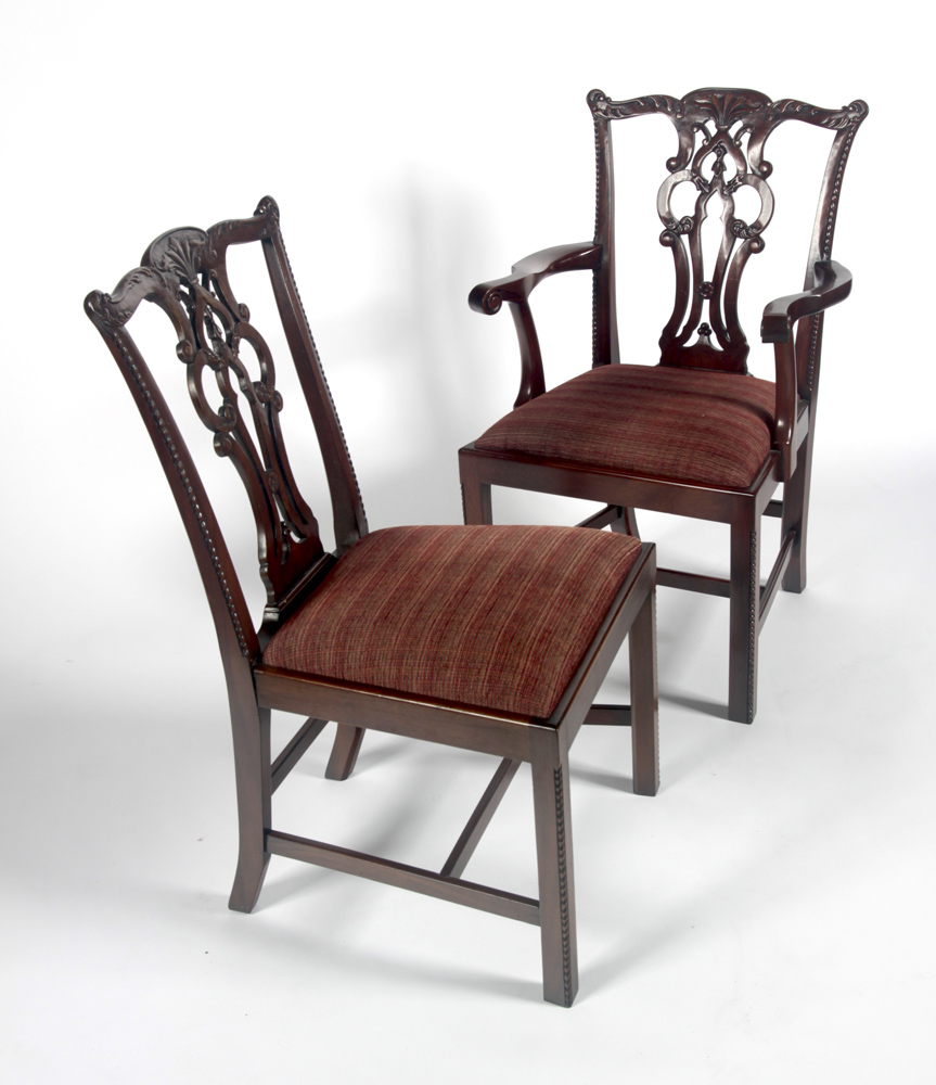 A set of twelve mahogany Chippendale style dining chairs